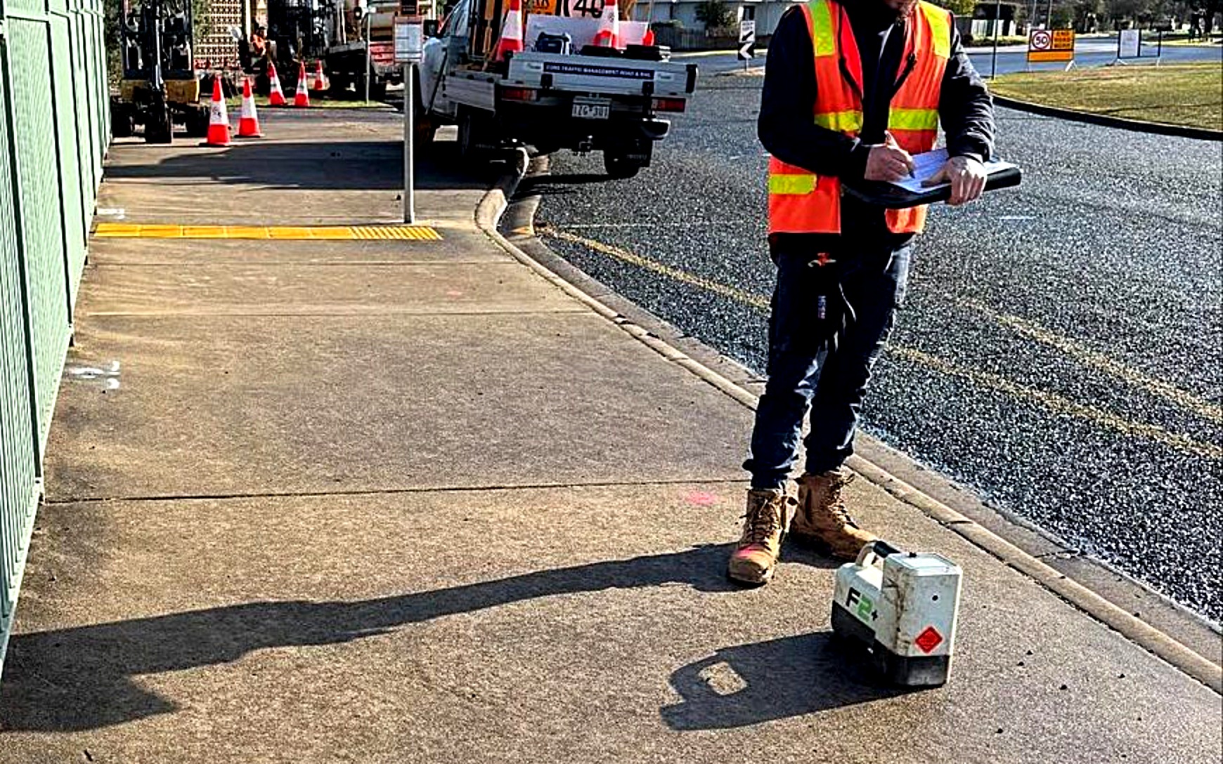 An All Network Connections crew member marking up a footpath with service locating equipment before a bore