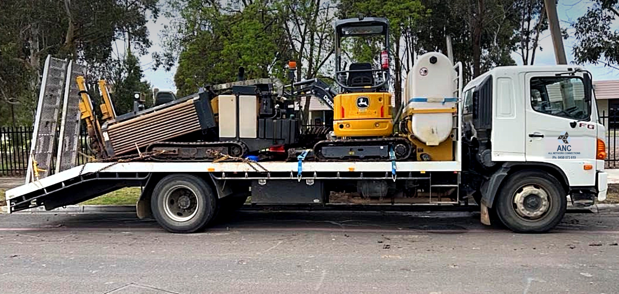 The All Network Connections truck loaded with the directional drilling rig, mini excavator and water tank